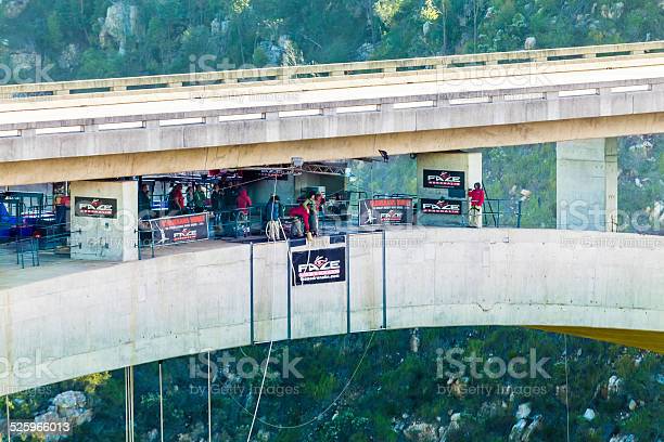 Knysna, South Africa -November, 16th 2014: The world's highest bungy jumping at Bloukrans in the Tsitsikamma forest of South Africa, a woman seen about to jump off the bridge. The bridge is situated between two mountains.